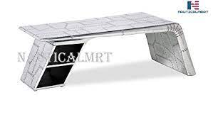Motoart is a team of designers who transform airplane parts into sleek, highly polished modern pieces of furniture, like a bed, chair, table and more. Aviator Airplane Wing Coffee Table Sale Coffee Tables Shop Buymorecoffee Com