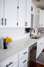 All white kitchen design rarely works well because it can be overwhelming. White Kitchen With Black Pulls White Kitchen Design Kitchen Design Black Kitchen Faucets
