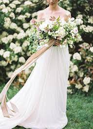 Learn how to save money and still look glamorous on your wedding day with this ribbon wedding bouquet tutorial. Head Over Heels For Bouquet Tails Topweddingsites Com