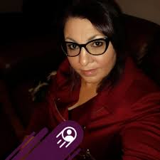 Is a car parked in front of a driveway legally parked if it blocks the  driveway?