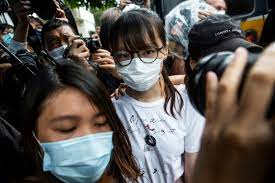 Chow sits in a van after being arrested at her home under the national security law in hong kong photo: Oqgsio Aubbb M