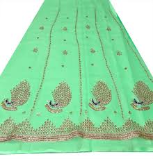 The male peacock tail contains spectacular beauty because of the brilliant, iridescent, diversified colors and the intricate, colorful eye patterns. Sea Green Colour Rajputi Poshak With Peacock Design