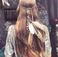 Natural, long, undone hair with a headband is back in style. Floral Crowns To Beach Waves These Are The Hippie Hairstyles You Need