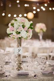 Add instant height to your centerpiece with our modern metal flower table stand for wedding reception centerpieces. Wedding Centerpiece Using Tall Chic Silver Vase With Hanging Jewels Wedding Centerpieces Mason Jars Wedding Centerpieces Wedding Decor Vases