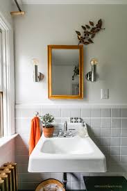 A successful bathroom lighting plan has multiple light sources, including both overhead and task, with good task lighting at the sink and mirror being key. Bathroom Vanity Lighting Ideas And Design Tips Apartment Therapy