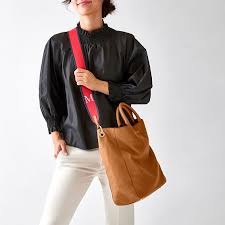 The camel colored trend is rocked by blogger neonblush with camel colored vintage scarves, shoulder zara bags, forever 21 sunglasses, leather strapped nine west sandals, red striped button down. Build Your Bag Straps Custom Bags Mark And Graham