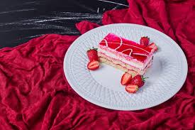 Place cake halves into the freezer for five minutes, just to make icing easier. Free Photo A Slice Of Strawberry Cake On A White Plate On Dark Background