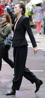 Milla Jovovich suffers a nip slip at star-studded Vogue shoot in Times  Square | Daily Mail Online