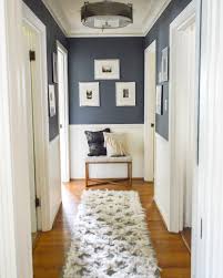 With a deep and rich brown door and wooden accessories, the white bench really pops in the small space. Hallway Design Plus Our Hallway Progress Hallway Colours Hallway Design Hallway Paint