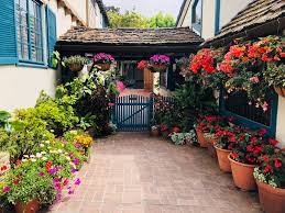 Delicate flowers adorn its landscapes, which are home to herds of deer as well as seals. The Garden Gate Story Inspiration From Carmel By The Sea Monterey Farmgirl