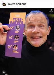 Flea with his son Darius Booker at a Los Angeles Lakers game 💜💛