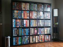 Boardgames Displayed Like Books I Don T Know Why This Never Occurred To Me Would Keep The Boxes From Collaps Board Game Storage Board Games Board Game Room