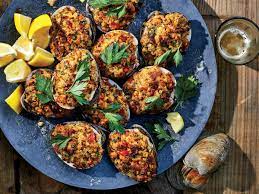 Packed Back Into Their Shells And Roasted Stuffies Are A Hearty Way To Enjoy Quahogs And A Staple Of Summer Meals In Rh Stuffies Recipe Wine Recipes Recipes