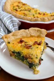 Spinach, cheddar cheese, bacon, eggs, and cream make up the delectable filling for this yummy quiche, which is made with a premade pie crust. Deep Dish Spinach Quiche With Bacon Small Town Woman