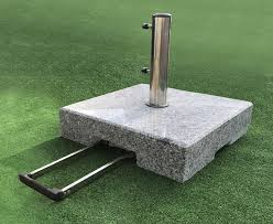 You're not sure how heavy your parasol base should be? Granite Parasol Base With Wheels And Telescopic Trolley Handle 70kg Lindsey Teak
