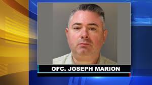 Philadelphia officer Officer Joseph Marion arrested for punching man, gun  picked up by child: Police
