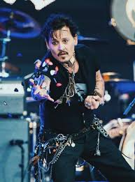 Depp even strums on his guitar at one point in the video and tests a new scent at another. If I Ever Caught Obe Of Johnny Depp S Guitar Picks I Would Die Young Johnny Depp Johnny Depp Johnny Depp Pictures