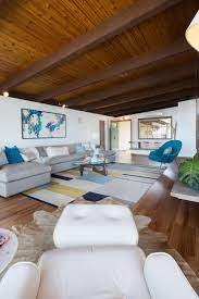 Furniture was up off the floor. Midcentury Living Room With Exposed Beams Hgtv
