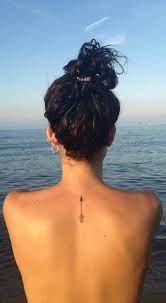 Women love spine tattoo on their back with a black ink design to make them appear ravishing and elegant. Pin On Female Tattoo Ideas