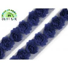 Riveting roses are laced together across the span of this trim, which will easily highlight any focal point on a garment or accessory. Roses Lace