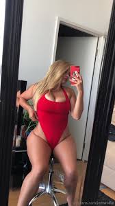 Jem Wolfie in red tight swimsuit
