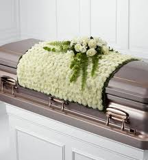 Coffin flowers coffin or casket flower arrangements are created specifically to be placed on the coffin during the service, and can be kept there until completion. Blanket Of Flowers Casket Spray