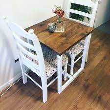 It has a white laminated top with wonderful deep dark blue dowel legs. The Judy 2 Seater Dining Table 2 Seater Dining Table Small Square Dining Table Diy Dining Table