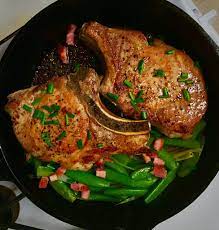 Melissa Clark S Seared Pork Chops With Peas Scallions And Pancetta From Dinner Changing The Game Her Brand Seared Pork Chops Braised Pork Chops Pork Chops