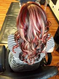 Stunning bright red hair with bleached blonde chunky streaks in big curls. 35 Incredible Black Hairstyles With Red Highlights