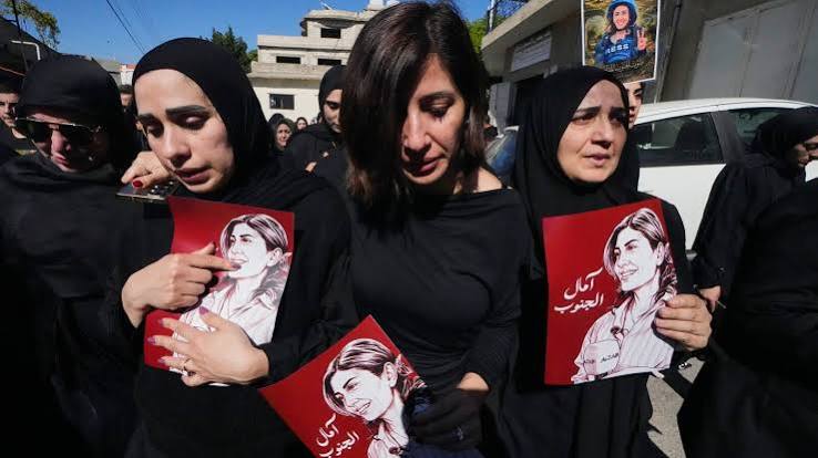 A memorial display featuring a photograph of journalist Amal Khalil following reports of her death in a targeted strike.