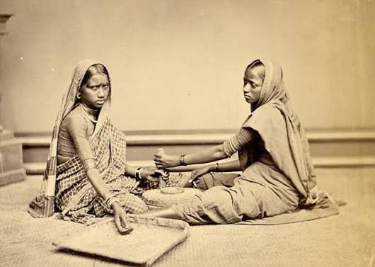 File:Two women grinding food grain at a mill - 1873.jpg - Wikimedia Commons