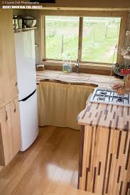 To make tiny house kitchen designs appear larger without any disturbing clutter to the eyes, strategic organization and decorating are the keys. Whimsical Pequod Tiny House Fits Family Of Four