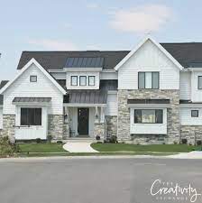 Dark roof, white plank siding, white 8. How Modern Farmhouse Exteriors Are Evolving