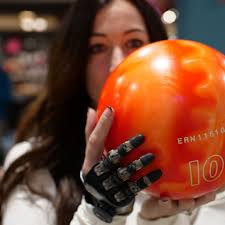 Meet Angie Coe (@bionic_angie), our incredible ambassador, showcasing her  partial hand prosthesis from Point Designs. With our trailblazing  prosthetic fingers and innovative socket design, Angie can confidently grip  a bowling ball and