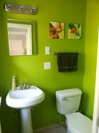 Green potted plants create a refreshing ambiance in this primary bathroom with facing sink vanities and a deep soaking tub flanked by sleek cabinets. Green Bathroom Ideas Pinterest Novocom Top