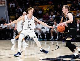 Utah state and weber state basketball teams take court for game. Sean Bairstow Men S Basketball Utah State University Athletics