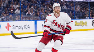 Carolina hurricanes defenseman dougie hamilton (19) follows the bouncing puck in the second period of an nhl hockey game against the nashville predators. Kf Zkfq3ziksym