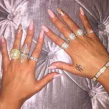 'clearly you don't change diapers with those claws.' Khloe Kardashian S Pink Nails Get Her Trendy Pink Gold Manicure Hollywood Life