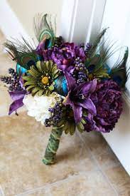 Peonies, orchids, lisianthus, scabiosa, roses, the list goes on and on. Purple Peacock Wedding Bridal Bouquet 100 00 Via Etsy I Like The Blue Purple And White But Am Not Wedding Bridal Bouquets Bridal Bouquet Peacock Wedding