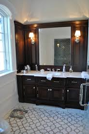 You can use wooden baskets or plastic bins to organize things in your open shelves. Bathroom Decor With Brown Cabinets Novocom Top