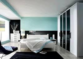 Dark Gray Headboard Bed Color Schemes For Small Bedrooms Gray Painted Wall Floating Tv Wall Striped Blanket Dark Brown Bedside Table Ev Dekorasyonu Evler Yatak