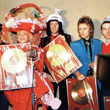 The Band Were Presented With Gold Disc Awards By Gertrude Shilling At The Crazy Hat Party In London In December 1979 Queen Band Queen Freddie Mercury Queen Photos