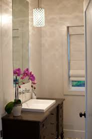 Underneath the pencil rail are a combination of 1 x 1 and 1 x 2 mexican mosaic tile. Before After Megan S Modern Mexican Tile Small Bathroom Mix Apartment Therapy