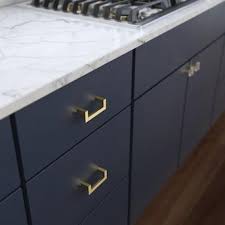 Once you've decided to add hardware to your cabinets (some cabinets styles don't require hardware), you'll need to decide on pulls versus knobs. Brainerd Squared Modern 3 In Center To Center Brushed Brass Novelty Handle Drawer Pulls Lowes Com In 2021 Cabinet Hardware Modern Handle Cabinet Gold Cabinet Hardware