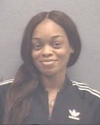 Woman is 4th person arrested in connection with homicide probe