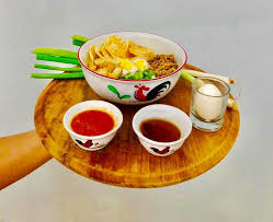 Bumbu spices mixture include shallot, garlic, red chili pepper, bruised lemongrass, black pepper, galangal and salam leaf (indonesian bayleaf). Bubur Ayam Ayam