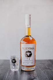 Skrewball Peanut Butter Whiskey From Ocean Beach California Black Sheep Shot Glass Product Shot On Wooden Table With White Bac Whiskey Perfect Drinks Drinks