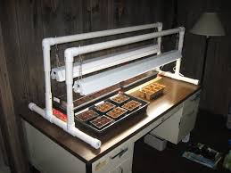 A light stand that's made out of pvc and costs you less than $5. Diy Light Stand And Heat Mat Grow Lights Diy Diy Lighting Grow Lights For Plants