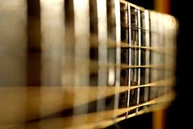 If they are touching or too close to each other you probably need to put more bow in your neck to prevent fret buzz from occurring somewhere on the fingerboard. How To Stop Fret Buzz On An Electric Guitar