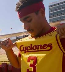 Iowa State Men's Basketball released a video showcasing new gold uniforms.  Here are some screen grabs from the video of the new uniforms with the  script “Cyclones”. A throwback. What do you